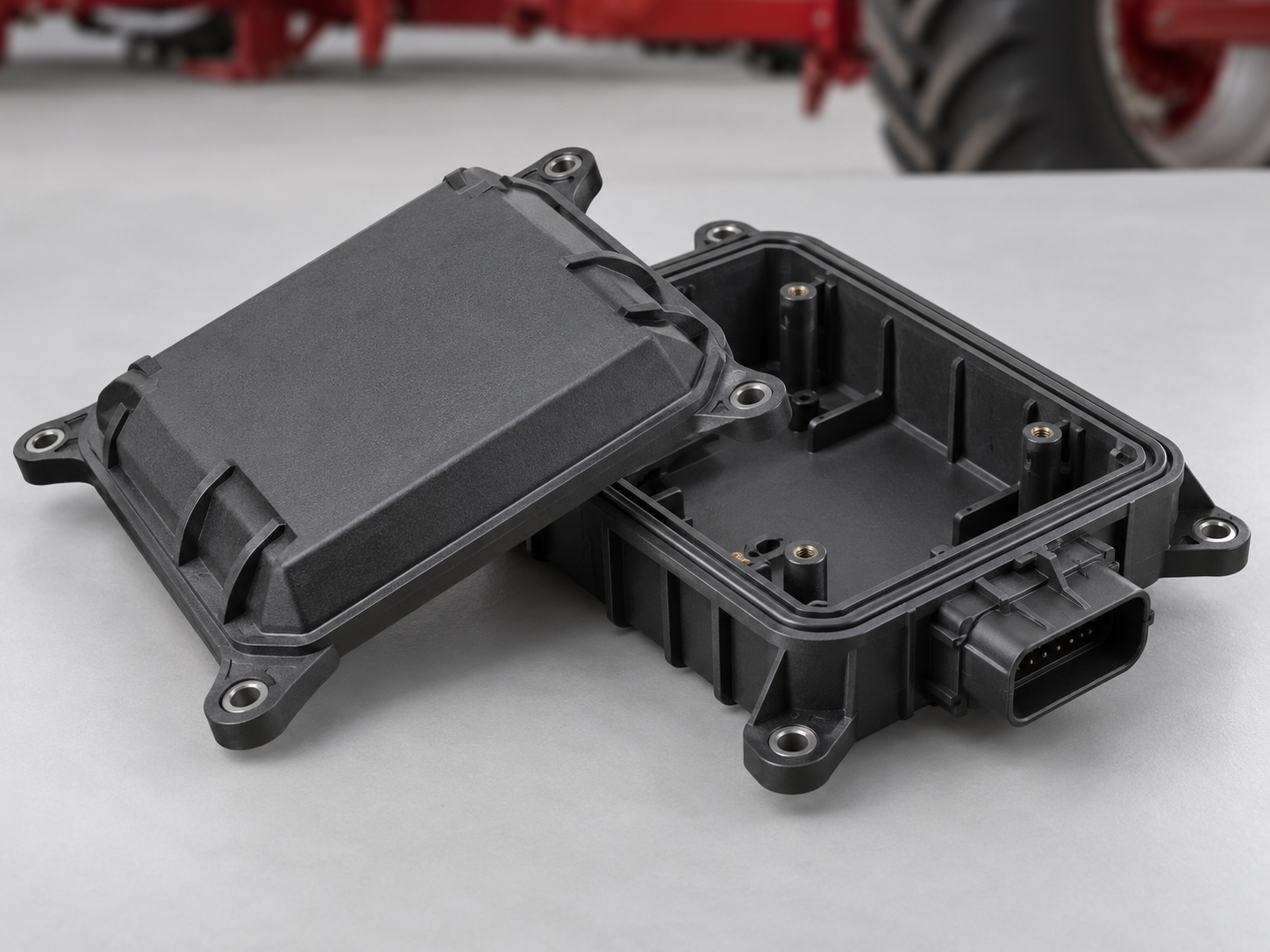 Injection molded control housing for agricultural machinery