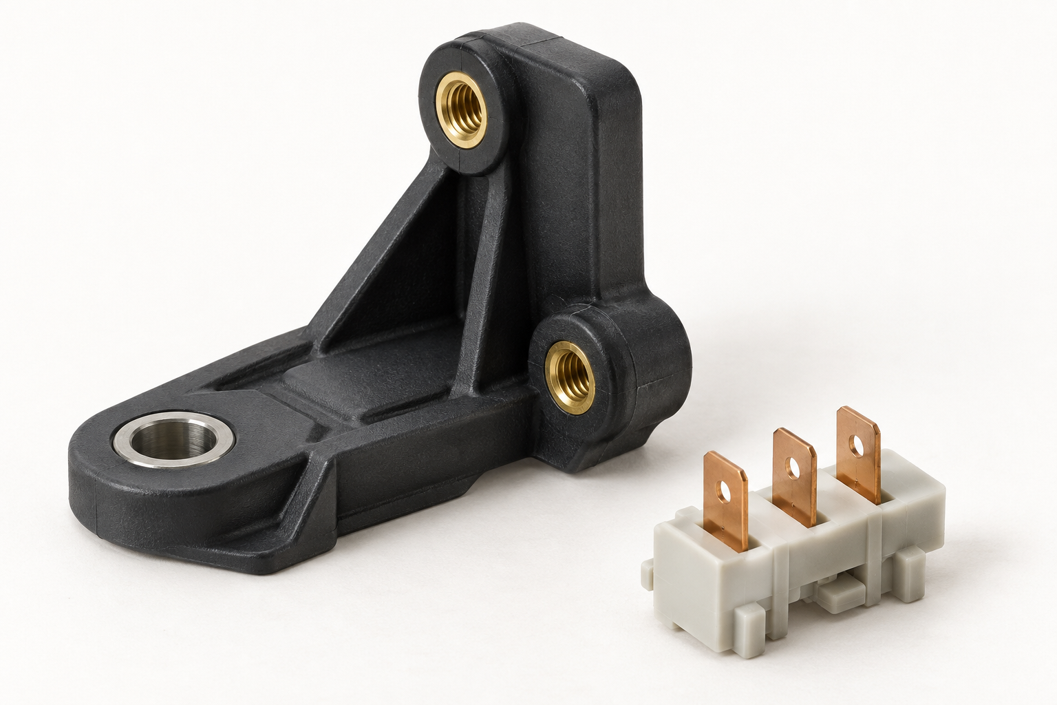 Insert-molded plastic parts incorporating brass threads, electrical contacts and a steel sleeve