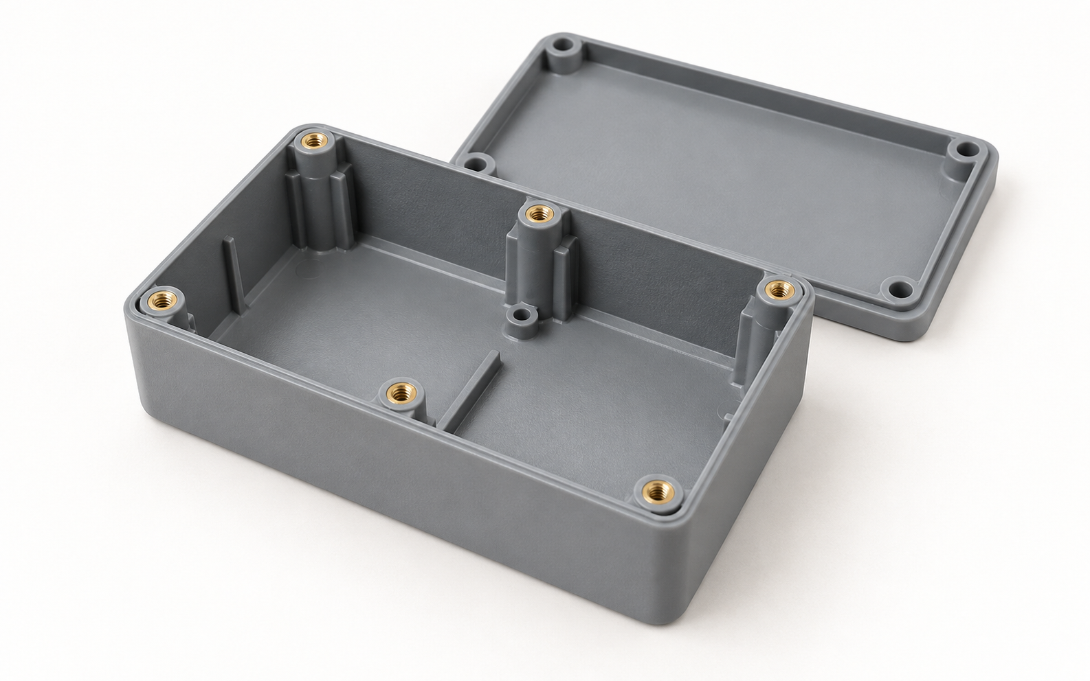 Molded instrument enclosure with integrated brass threaded inserts